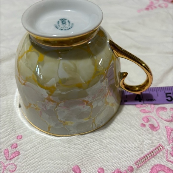 Vintage Gold and White Teacup and Saucer Set with Luxurious Design - Picture 9 of 10